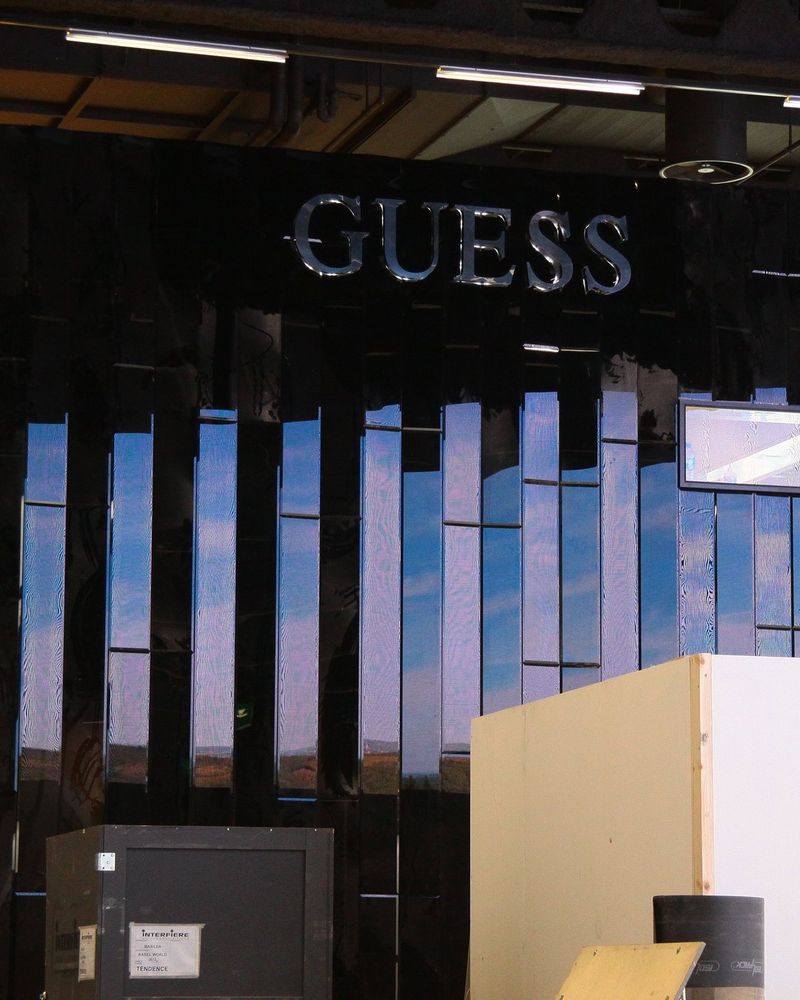 The Guess stand under construction at Baselworld, with GUESS lettering above a black mirrored fascia