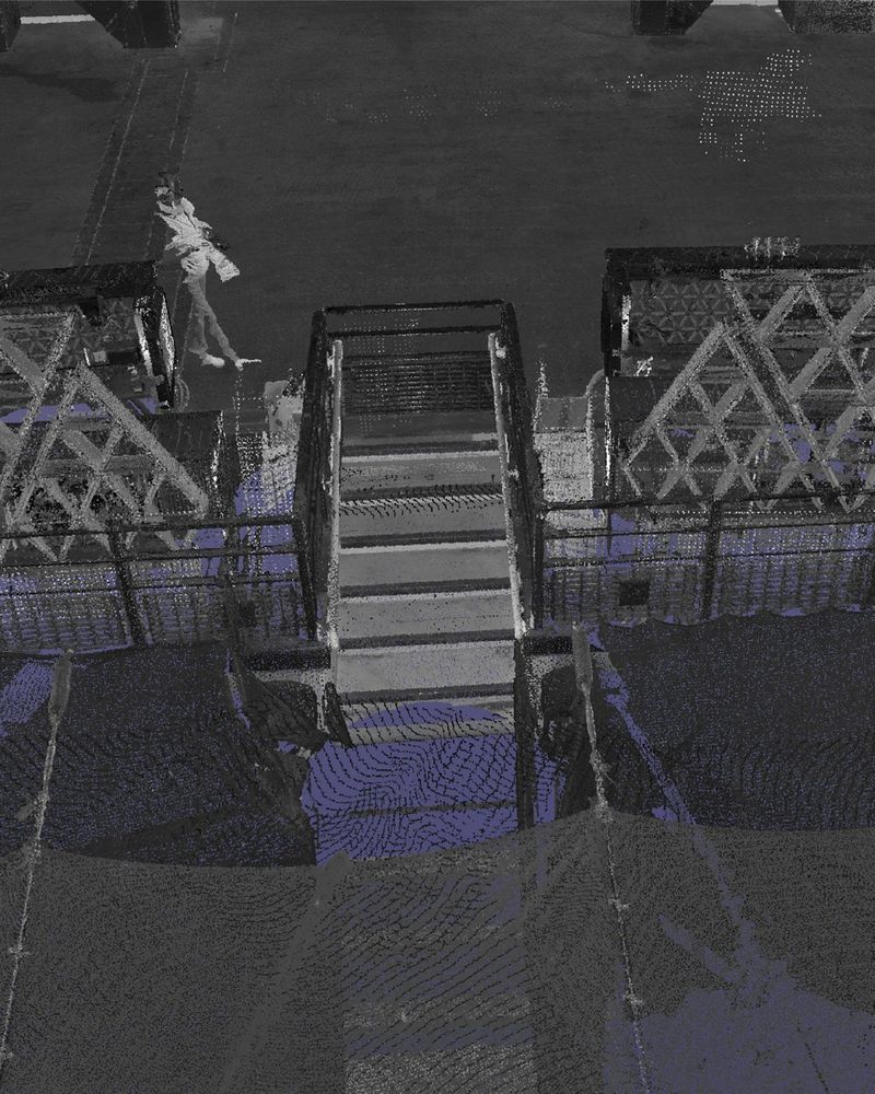 Laser-scan point cloud of a stair and barriers inside the London Stadium, in grey and purple