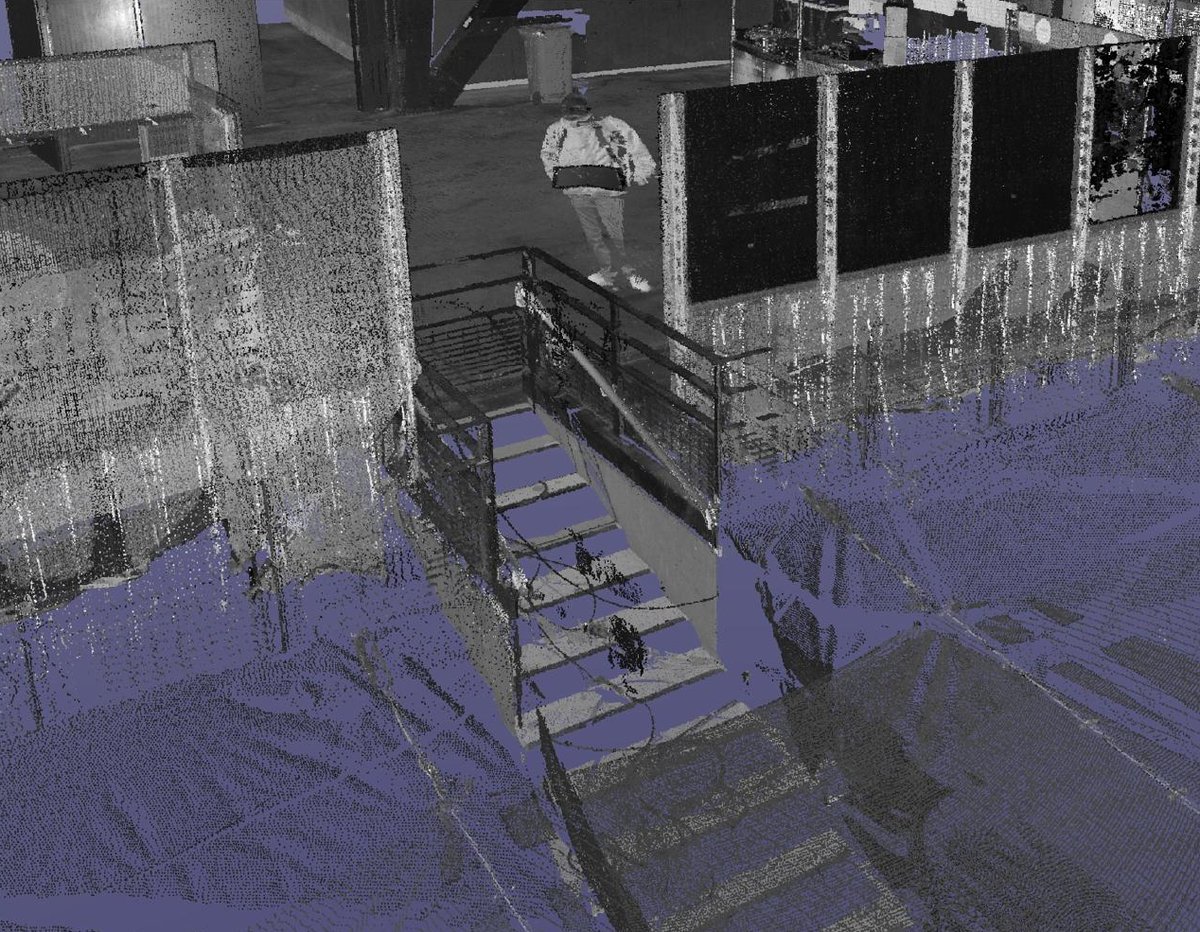 Laser-scan point cloud of a concourse at the London Stadium, with a new stair and barriers modelled into the scan